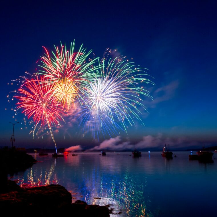 green, red, and white fireworks on sky at nighttime